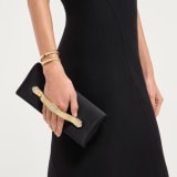 Bvlgari Tubogas evening clutch in black satin with black nappa leather lining. Iconic Tubogas handle in gold-plated brass embellished with zirconia and a magnetic closure. 295432 image 1