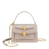 Alexander Wang x Bulgari small belt bag in moonbeam pearl light grey calf leather with black nappa leather lining. Captivating double Serpenti head magnetic closure in antique gold-plated brass embellished with red enamel eyes. 292315 image 1
