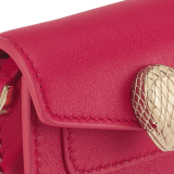Serpenti Forever micro bag in gold calf leather. Captivating snakehead closure in light gold-plated brass embellished with red enamel eyes. SEA-NANOCROSSBODYa image 4