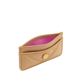 Serpenti Cabochon card holder in black calf leather with maxi matelassé pattern. Captivating snakehead rivet in gold-plated brass embellished with red enamel eyes. SCB-CCHOLDER image 2