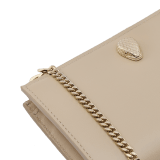 Serpenti Forever zipped card holder in bright travertine ivory calf leather with moonrock light grey and aquamarine nappa leather interior. Captivating snakehead rivet in light gold-plated brass embellished with red enamel eyes. SEA-MC-CCHOLDS image 4