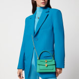 Alexander Wang x Bulgari small belt bag in spring peridot green calf leather with black nappa leather lining. Captivating double Serpenti head closure in antique gold-plated brass embellished with red enamel eyes. 291888 image 6
