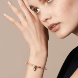 "Serpenti Forever" bracelet in Rose Gold pink fabric, with a gold-plated brass plate. Iconic snakehead charm enameled in black and white agate, with seductive black enamel eyes. SERP-MINISTRINGa image 2