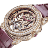 Octo Roma Tourbillon Lumière watch with mechanical manufacture skeletonized movement, manual winding and tourbillon, 18 kt rose gold case set with brilliant-cut diamonds, 18 kt rose gold arch set with round brilliant-cut diamonds and rubies, transparent case back and red alligator bracelet. Water-resistant up to 30 metres 103751 image 2