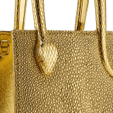 Serpentine mini tote bag in gold galuchat skin with 24 kt gold treatment, shiny gold Mirage nappa leather sides and black nappa leather lining. Captivating snake-shaped handles in gold-plated brass including 3 µ of 24 kt gold, embellished with engraved scales and red enamel eyes. Exclusive Bulgari 50th anniversary in the US Edition. 292705 image 5