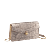 Serpenti Forever chain pochette in milky opal metallic karung with milky opal nappa leather lining. Captivating snakehead magnetic closure in gold-plated brass embellished with foggy opal enamel and black onyx eyes. 294909 image 1
