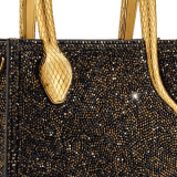 Serpentine mini tote bag in black with black crystals inserts hand-set on suede leather and black nappa leather lining. Captivating snake body-shaped handles in light gold-plated brass embellished with engraved scales and red enamel eyes. 293916 image 5