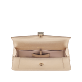 Serpenti Forever clutch in light gold striated calf leather with crystal rose nappa leather lining. Captivating snakehead magnetic closure in light gold-plated brass embellished with pavé-set black zirconia stones, and black onyx eyes. 295468 image 3
