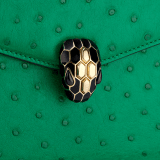 Serpenti Forever small top handle bag in vivid emerald green shiny ostrich skin with emerald green nappa leather lining. Captivating snakehead magnetic closure in light gold-plated brass embellished with black enamel and light gold-plated brass scales, and black onyx eyes. 293264 image 5