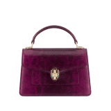 Serpenti Forever mini top handle bag in light amethyst pure karung with light amethyst nappa leather lining. Captivating snakehead magnetic closure in gold-plated brass embellished with light amethyst enamel and gold-plated brass scales, and black onyx eyes. SEA-001-1283XS-kar image 1