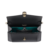 Serpenti Forever East-West small shoulder bag in black calf leather with emerald green gros grain lining. Captivating snakehead magnetic closure in light gold-plated brass embellished with black and white agate enamel scales, and green malachite eyes. 1237-CLa image 5