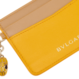 Serpenti Forever card holder in gold Urban grain calf leather. Captivating snakehead charm in light gold-plated brass embellished with red enamel eyes. SEA-CC-HOLDER-CLa image 4