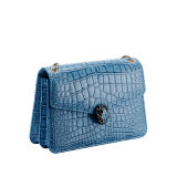 Serpenti Forever shoulder bag in Niagara sapphire blue Cloudy alligator skin with black nappa leather lining. Captivating snakehead closure in light gold-plated brass embellished with black enamel scales, blue jade scales in the centre and black onyx eyes. 1140HE-A image 2