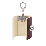 Bulgari Clip keyholder in fudge amethyst brown grain calf leather with butter onyx beige grain calf leather interior and edges, and light cream moiré lining. Iconic palladium-plated brass clip and folded closure. BCM-KEY-HOLD-CLASPa image 2