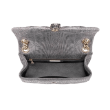 Serpenti Cabochon shoulder bag in soft matelassé charcoal diamond metallic karung skin with graphic motif. Snakehead closure in light gold plated brass decorated with matte black and glitter charcoal diamond enamel, and black onyx eyes. 981-MK image 4