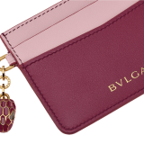 Serpenti Forever card holder in gold Urban full-grain calf leather. Captivating snakehead charm in light gold-plated brass embellished with red enamel eyes. SEA-CC-HOLDER-CLa image 4