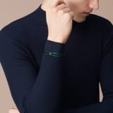 Serpenti Forever bracelet in emerald green fabric. Light gold-plated brass captivating snakehead décor embellished with emerald green and black enamel scales, and black enamel eyes. SERP-STRINGd image 3