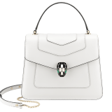 “Serpenti Forever” top handle bag in emerald green calf leather. Iconic snake head closure in light gold plated brass enhanced with black and white agate enamel and green malachite eyes. 1050-CL image 2
