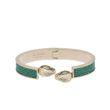 Serpenti Forever bangle bracelet in light gold-plated brass with soft emerald green galuchat skin inserts. Captivating double snakehead hinge closure in light gold-plated brass embellished with red enamel eyes. SERPHINGE-LMCL-SG image 1