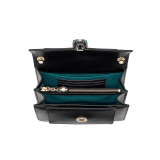 Serpenti Forever small crossbody bag in emerald green calf leather with amethyst purple grosgrain lining. Captivating snakehead closure in light gold-plated brass embellished with black and white agate enamel scales and green malachite eyes. 1082-CLa image 4