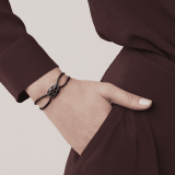"Serpenti Forever" bracelet in Midnight Sapphire blue fabric with an alluring snakehead décor in light gold-plated brass enamelled in black and glittery Hawk's Eye grey, with seductive black enamel eyes. SERP-STRINGd image 1