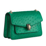 Serpenti Forever medium shoulder bag in vivid emerald green shiny ostrich skin with emerald green nappa leather lining. Captivating snakehead magnetic closure in light gold-plated brass embellished with black enamel and light gold-plated brass scales and black onyx eyes. 293263 image 2