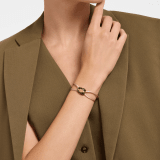 "Serpenti Forever" bracelet in Midnight Sapphire blue fabric with an alluring snakehead décor in light gold-plated brass enamelled in black and glittery Hawk's Eye grey, with seductive black enamel eyes. SERP-STRINGd image 1