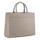 Bulgari Logo medium tote bag in black calf leather with hot-stamped Infinitum pattern on the main body and teal topaz green grosgrain lining. Light gold-plated brass hardware and magnet closure. BVL-1251M-ICL image 1