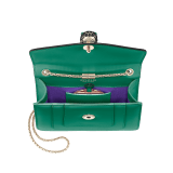 Serpenti Forever small crossbody bag in emerald green calf leather with amethyst purple grosgrain lining. Captivating snakehead closure in light gold-plated brass embellished with black and white agate enamel scales and green malachite eyes. 422-CLa image 4
