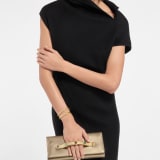 Bvlgari Tubogas Cabochon evening clutch in gold striated calf leather with crystal rose nappa leather lining. Iconic Tubogas handle in gold-plated brass embellished with coloured cabochon hard stones, zirconia and magnetic closure. 295471 image 1