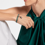 Serpenti Forever bracelet in emerald green braided calf leather and light gold-plated brass chain with magnetic clasp closure. Captivating snakehead charm with black and white agate enamel scales and black enamel eyes. SerpBraidChain-WCL-EG image 2