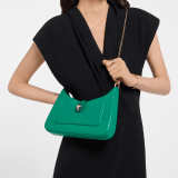 Serpenti Baia small shoulder bag in vivid emerald green Metropolitan calf leather with black nappa leather lining. Captivating snakehead magnetic closure in light gold-plated brass embellished with bright forest emerald green enamel and light gold-plated brass scales, and black onyx eyes; additional zipped top closure. SEA-1274293589 image 1