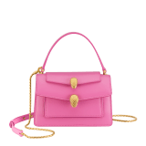 Alexander Wang x Bulgari small belt bag in azalea quartz pink calf leather with black nappa leather lining. Captivating double Serpenti head magnetic closure in antique gold-plated brass embellished with red enamel eyes. 292314 image 1