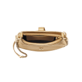 Serpenti Ellipse small crossbody bag in Urban grain and smooth ivory opal calf leather with flamingo quartz pink grosgrain lining. Captivating snakehead closure in gold-plated brass embellished with black onyx scales and red enamel eyes. 1204-UCL image 12