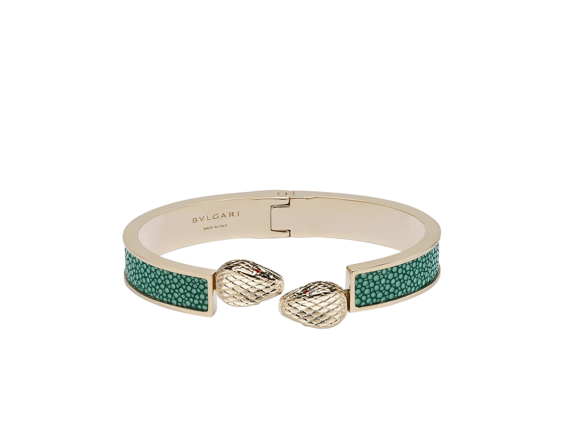 Serpenti Forever bangle bracelet in light gold-plated brass with soft emerald green galuchat skin inserts. Captivating double snakehead hinge closure in light gold-plated brass embellished with red enamel eyes. SERPHINGE-LMCL-SG image 1