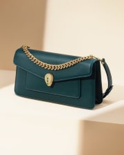 Serpenti East-West Maxi Chain bag in green calf leather with chain handle and snakehead closure.