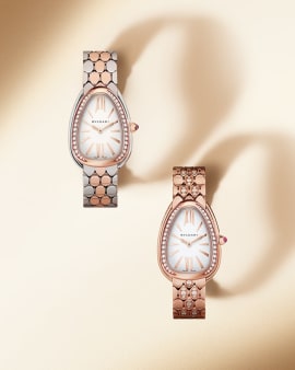 Serpenti Seduttori watches, one in rose gold and one in rose gold and steel, with diamonds and white dial.