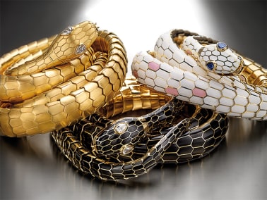 Serpenti Heritage yellow gold belts with white or black enamel scales and gemstone eyes.
