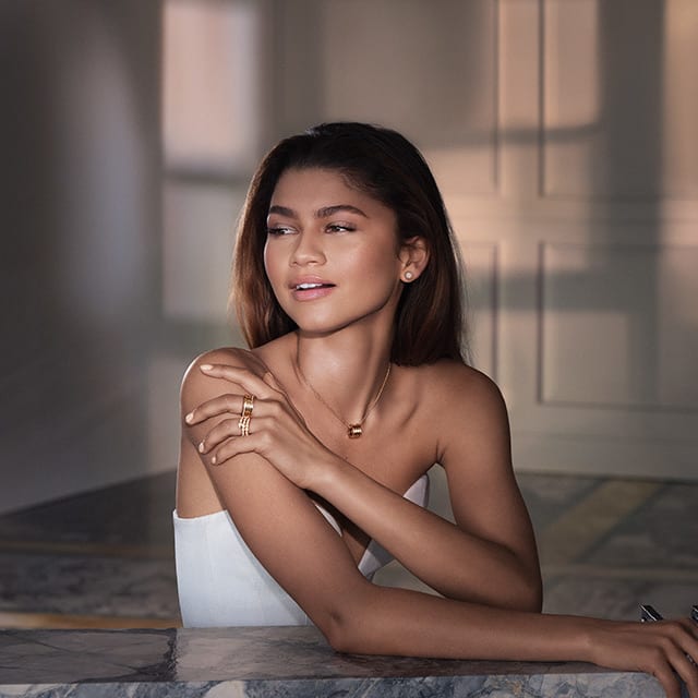 Zendaya wearing a B.zero1 rose gold ring and pendant necklace and a Serpenti ring with diamonds.