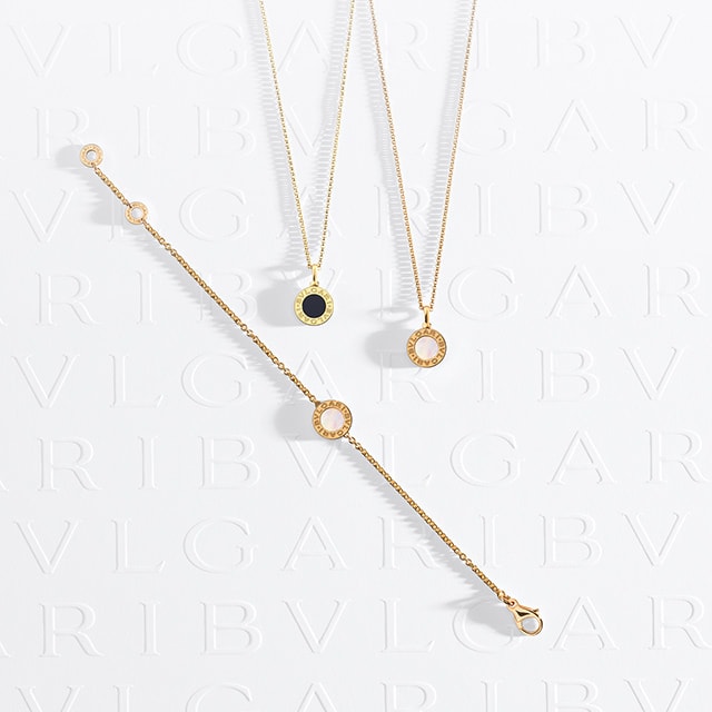 Two Bvlgari Bvlgari necklaces and bracelet in rose gold.
