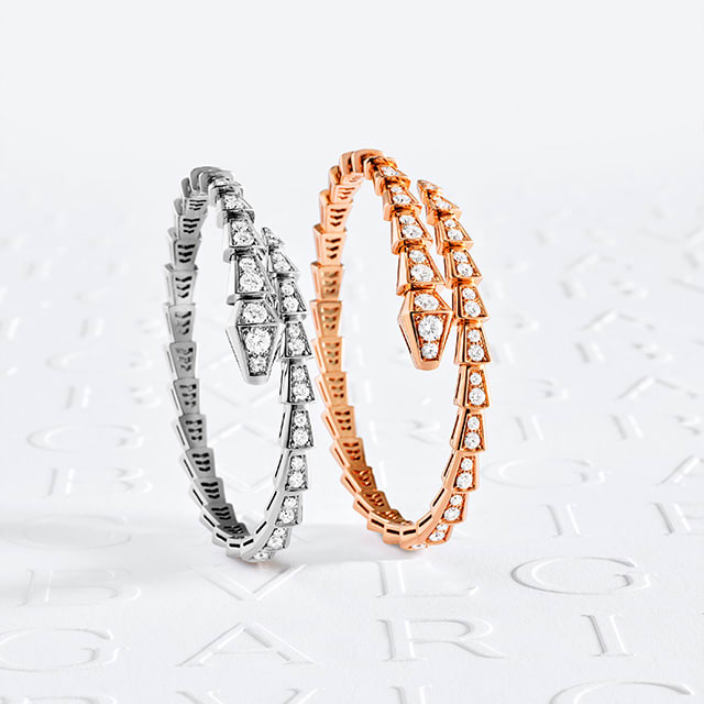 Serpenti bracelets in yellow and white gold with diamonds. Creative shot.