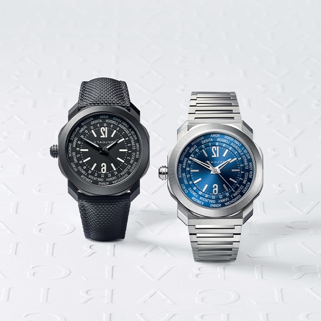 Octo Roma WorldTimer watch, one in DLC steel and one in steel, maxilogo backdrop.