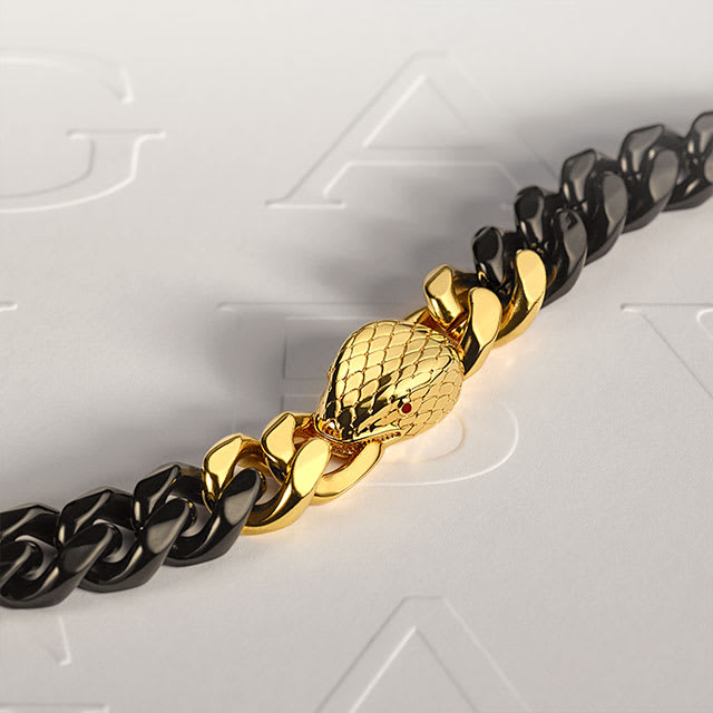 Two-headed Serpenti bracelet in golden karung skin on white Bvlgari logo backdrop.