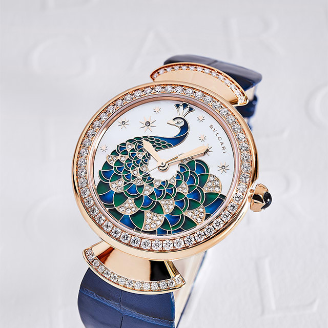 Divas' Dream Peacock rose gold watch set with diamonds, featuring a mother-of-pearl dial embellished with a hand-painted peacock and diamonds.
