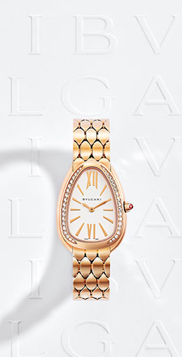 Serpenti Seduttori rose gold watch with diamonds on the bezel and model wearing Serpenti creations. 