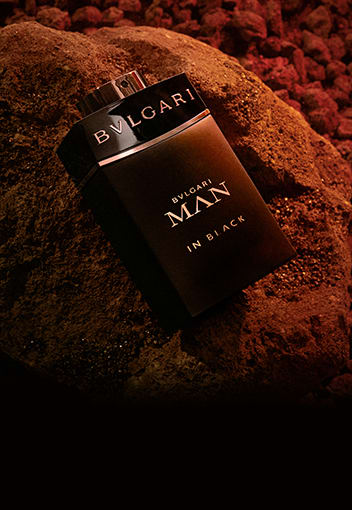 Bottle of the Bulgari Man Rain essence fragrance for men, creative close up shot.
