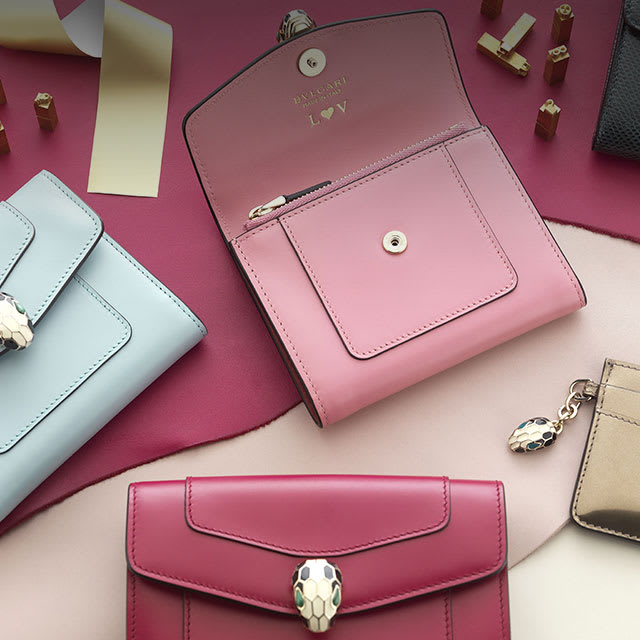 Bvlgari Serpenti personalised wallets with initials in pink, plum and light blue calf leather.