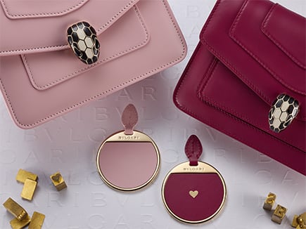Serpenti Forever calf leather bags with mirror, one of which featuring a heart hot stamping on the back.