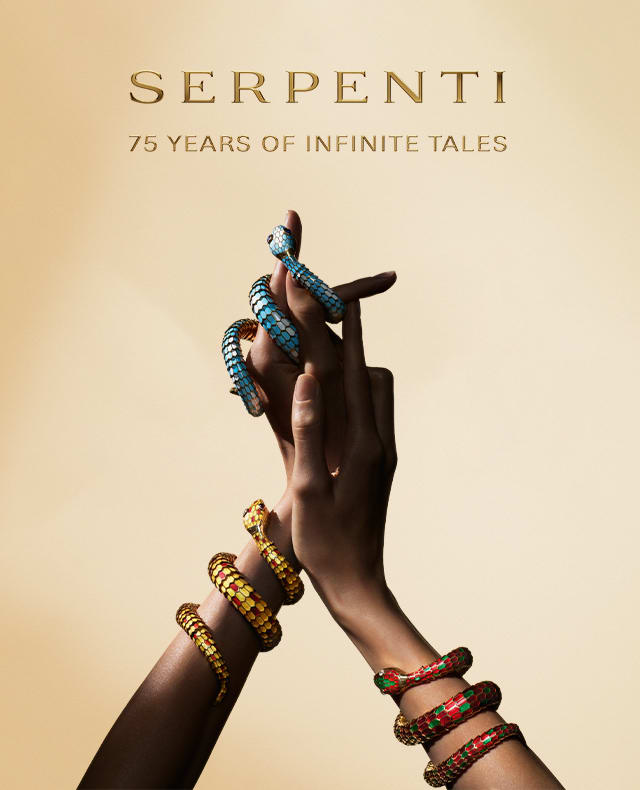 Two hands wearing Serpenti jewels.