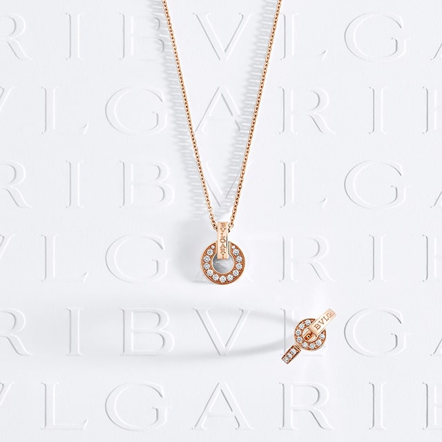 A Divas' Dream rose gold necklace with diamonds and malachite, and a BVLGARI BVLGARI openwork necklace in rose gold with pavé diamonds.